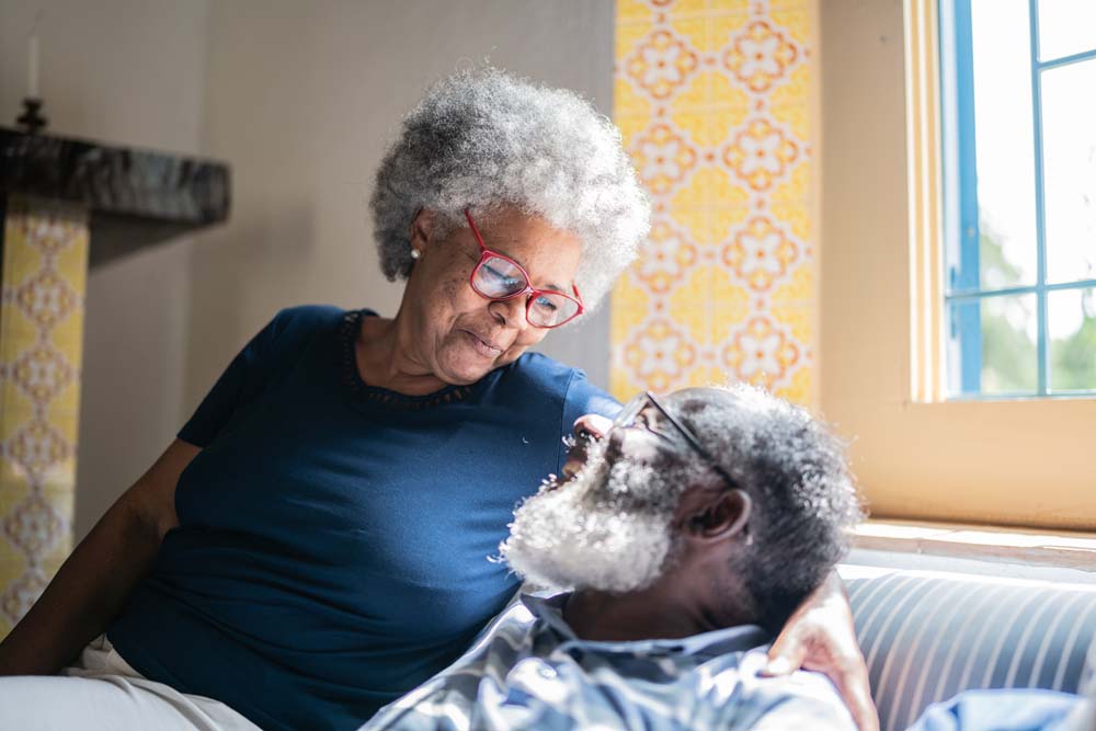 Old people holding each other looking lovingly into each others eyes.